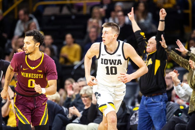 Iowa guard Joe Wieskamp (10) runs up court after making a 3-point basket as Minnesota's Payton Willis (0) defends during a NCAA Big Ten Conference men's basketball game, Monday, Dec. 9, 2019, at Carver-Hawkeye Arena in Iowa City, Iowa.