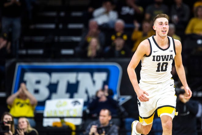 Iowa guard Joe Wieskamp (10) smiles while running up court during a NCAA Big Ten Conference men's basketball game, Monday, Dec. 9, 2019, at Carver-Hawkeye Arena in Iowa City, Iowa.