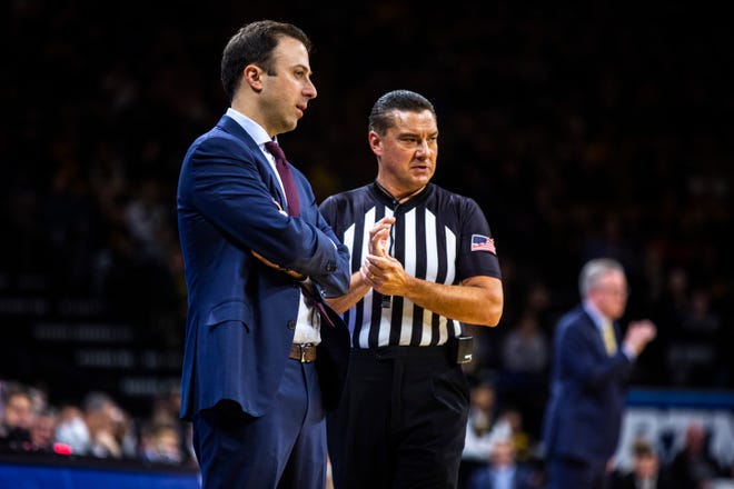 Minnesota head coach Richard Pitino talks with an official during a NCAA Big Ten Conference men's basketball game, Monday, Dec. 9, 2019, at Carver-Hawkeye Arena in Iowa City, Iowa.