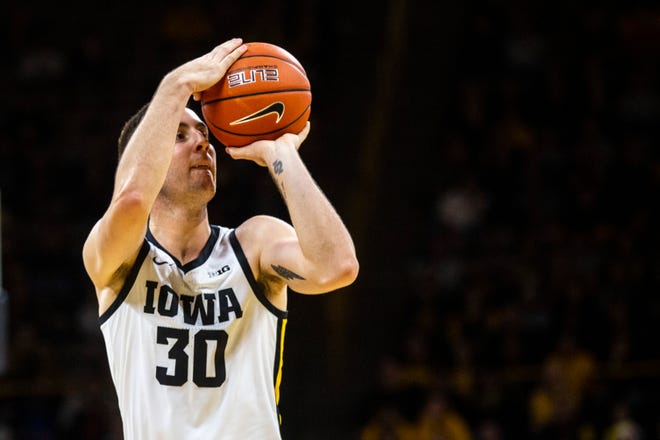 Iowa guard Connor McCaffery (30) makes a 3-point basket during a NCAA Big Ten Conference men's basketball game, Monday, Dec. 9, 2019, at Carver-Hawkeye Arena in Iowa City, Iowa.