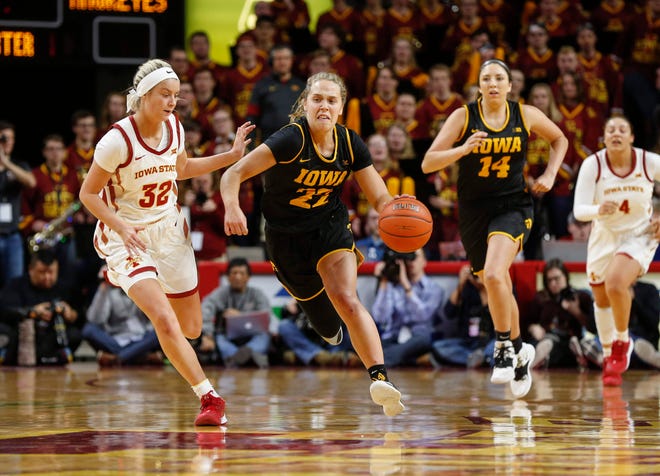 Iowa senior Kathleen Doyle moves the ball up the court against Iowa State during the CyHawk Series women's basketball game on Wednesday, Dec. 11, 2019, at Hilton Coliseum in Ames, Iowa.
