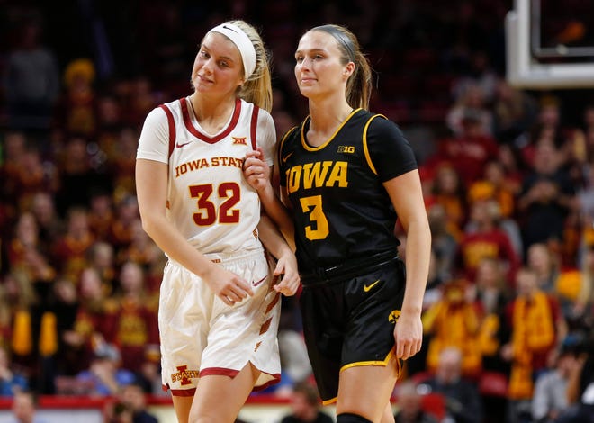 Iowa senior Makenzie Meyer, right, playfully battles for position against Iowa State freshman Maddie Frederick prior to the start of the third quarter during the CyHawk Series women's basketball game on Wednesday, Dec. 11, 2019, at Hilton Coliseum in Ames, Iowa.