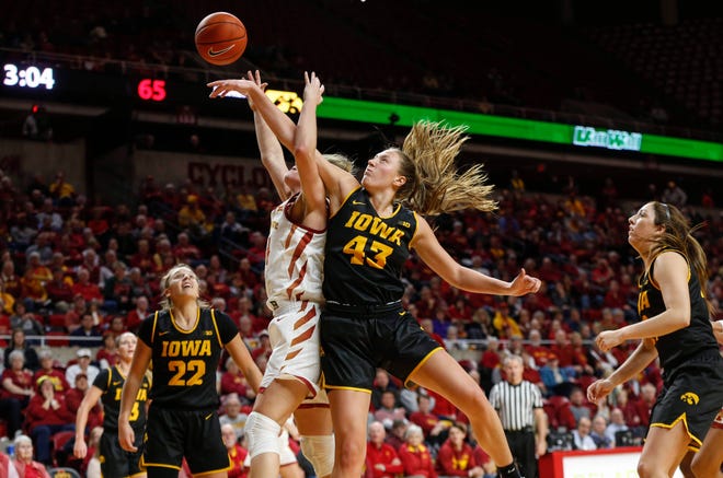 Iowa senior Amanda Ollinger is called for a foul after knocking the ball away from Iowa State sophomore Ashley Joens during the CyHawk Series women's basketball game on Wednesday, Dec. 11, 2019, at Hilton Coliseum in Ames, Iowa.