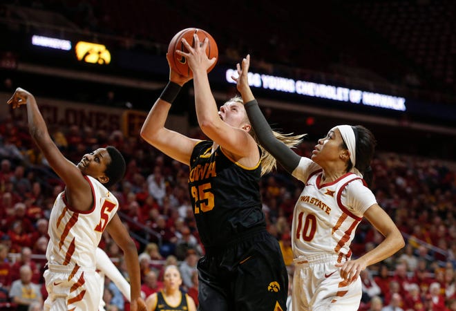Iowa sophomore Monika Czinano posts up under the basket in the first quarter against Iowa State during the CyHawk Series women's basketball game on Wednesday, Dec. 11, 2019, at Hilton Coliseum in Ames, Iowa.