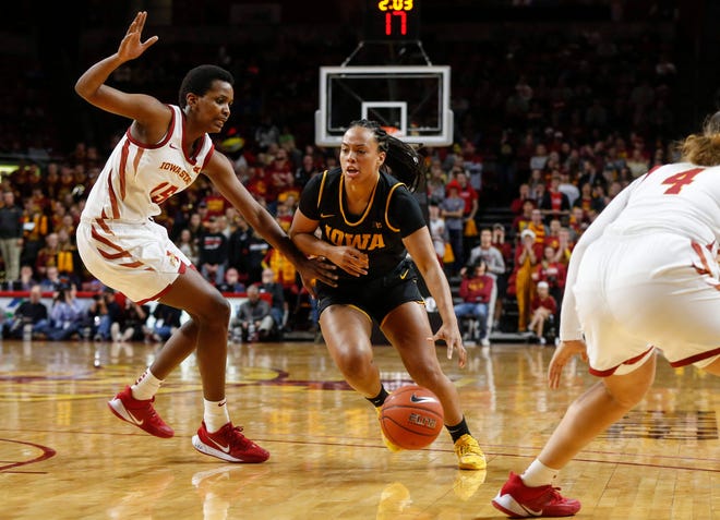 Iowa junior Alexis Sevillian drives the ball in against Iowa State during the CyHawk Series women's basketball game on Wednesday, Dec. 11, 2019, at Hilton Coliseum in Ames, Iowa.