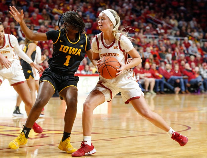 Iowa State freshman Maggie Espenmiller-McGraw drives in against Iowa's Tomi Taiwo during the CyHawk Series women's basketball game on Wednesday, Dec. 11, 2019, at Hilton Coliseum in Ames, Iowa.
