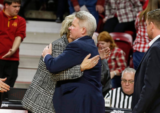 Iowa State women's head basketball coach Bill Fennelly gets a hug from Iowa women's head coach Lisa Bluder after Iowa beat the Cyclones during the CyHawk Series women's basketball game on Wednesday, Dec. 11, 2019, at Hilton Coliseum in Ames, Iowa.