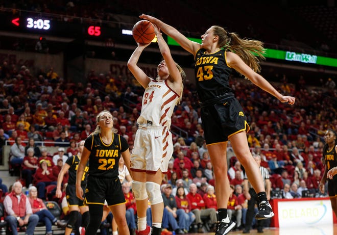 Iowa senior Amanda Ollinger is called for a foul after knocking the ball away from Iowa State sophomore Ashley Joens during the CyHawk Series women's basketball game on Wednesday, Dec. 11, 2019, at Hilton Coliseum in Ames, Iowa.