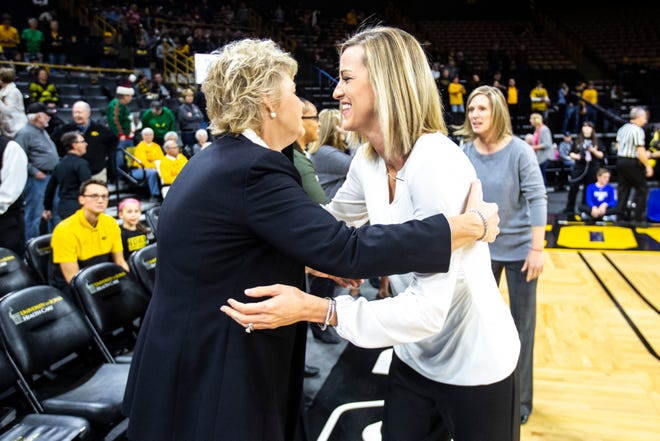 Iowa head coach Lisa Bluder, left, embraces Drake head coach Jennie Baranczyk before a NCAA non-conference women's basketball game, Saturday, Dec. 21, 2019, at Carver-Hawkeye Arena in Iowa City, Iowa.