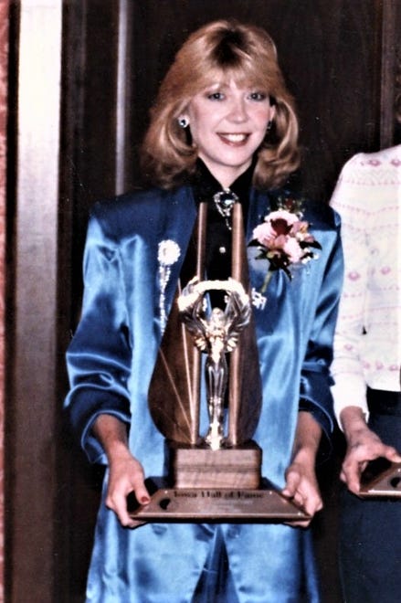 Molly (Van Benthuysen) Bolin is inducted into the Iowa Girls Athletic Union Hall of Fame in 1986.