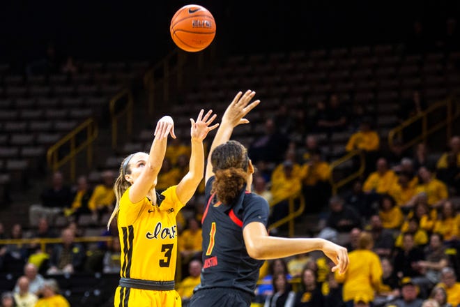 Iowa guard Makenzie Meyer (3) makes a 3-point basket as Maryland forward Shakira Austin (1) defends during a NCAA college Big Ten Conference women's basketball game, Thursday, Jan. 9, 2020, at Carver-Hawkeye Arena in Iowa City, Iowa.