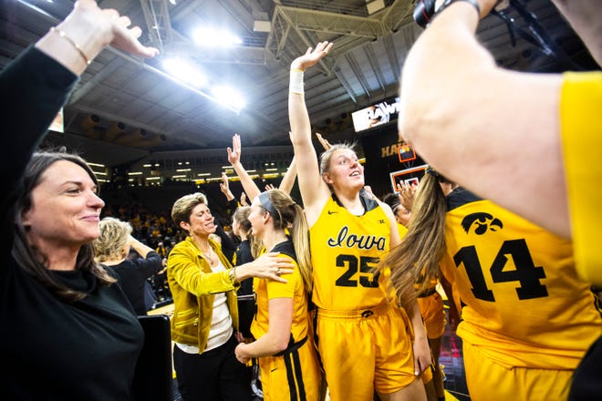 Iowa center Monika Czinano (25) waves to fans after a NCAA college Big Ten Conference women's basketball game against Maryland, Thursday, Jan. 9, 2020, at Carver-Hawkeye Arena in Iowa City, Iowa.