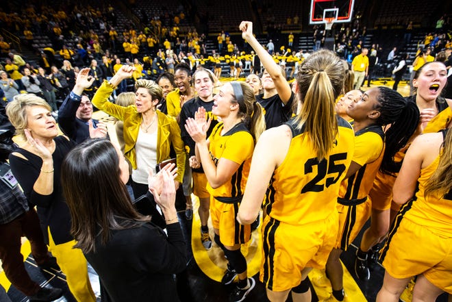 Iowa head coach Lisa Bluder, far left, and associate head coach Jan Jensen celebrate with players after a NCAA college Big Ten Conference women's basketball game, Thursday, Jan. 9, 2020, at Carver-Hawkeye Arena in Iowa City, Iowa.
