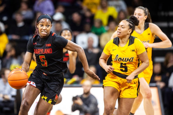 Maryland guard Kaila Charles, left, takes the ball up court as Iowa guard Alexis Sevillian defends during a NCAA college Big Ten Conference women's basketball game, Thursday, Jan. 9, 2020, at Carver-Hawkeye Arena in Iowa City, Iowa.