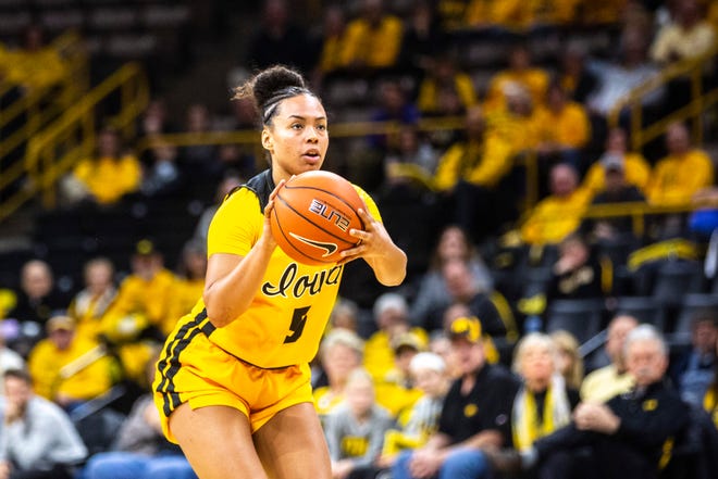 Iowa guard Alexis Sevillian (5) makes a 3-point basket during a NCAA college Big Ten Conference women's basketball game, Thursday, Jan. 9, 2020, at Carver-Hawkeye Arena in Iowa City, Iowa.