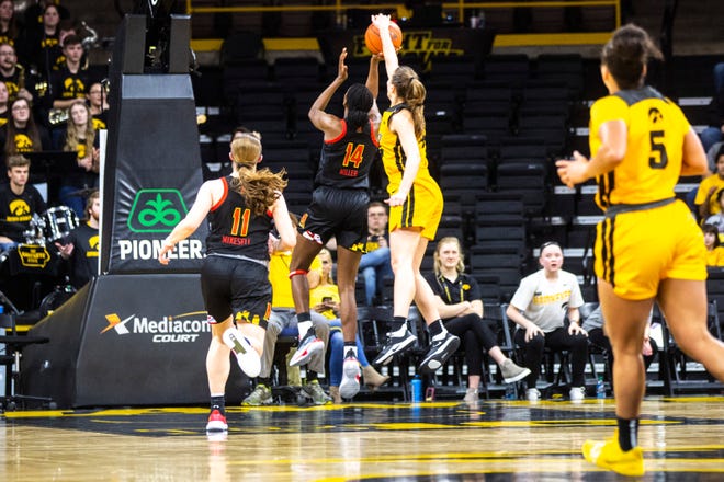 Iowa forward Amanda Ollinger (43) blocks a shot from Maryland guard Diamond Miller (14) during a NCAA college Big Ten Conference women's basketball game, Thursday, Jan. 9, 2020, at Carver-Hawkeye Arena in Iowa City, Iowa.