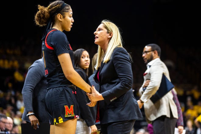 Maryland head coach Brenda Frese talks with Maryland forward Shakira Austin, left, in a timeout during a NCAA college Big Ten Conference women's basketball game, Thursday, Jan. 9, 2020, at Carver-Hawkeye Arena in Iowa City, Iowa.