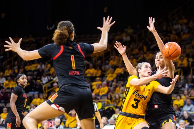 Iowa guard Makenzie Meyer (3) loses a ball as Maryland forwards Shakira Austin (1) and Stephanie Jones, right, defend during a NCAA college Big Ten Conference women's basketball game, Thursday, Jan. 9, 2020, at Carver-Hawkeye Arena in Iowa City, Iowa.