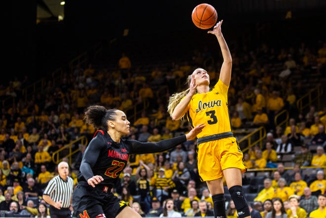 Iowa guard Makenzie Meyer (3) makes a basket as Maryland guard Blair Watson (22) defends during a NCAA college Big Ten Conference women's basketball game, Thursday, Jan. 9, 2020, at Carver-Hawkeye Arena in Iowa City, Iowa.