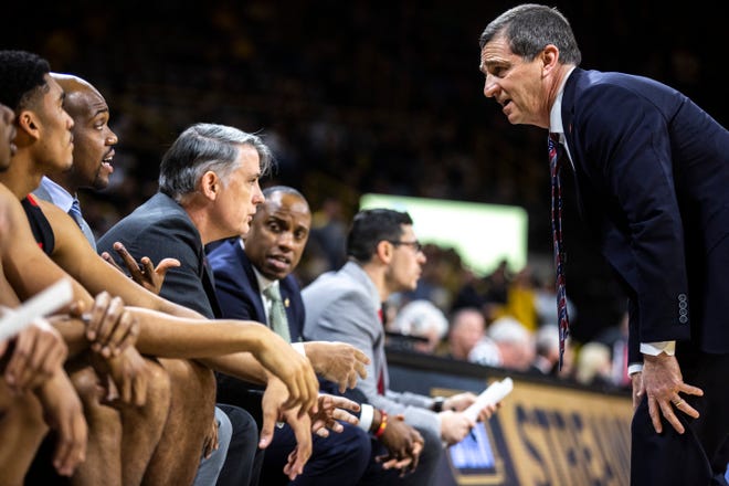 Maryland head coach Mark Turgeon talks with coaches during a NCAA college Big Ten Conference men's basketball game, Friday, Jan. 10, 2020, at Carver-Hawkeye Arena in Iowa City, Iowa.