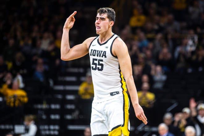 Iowa center Luka Garza (55) reacts after making a 3-point basket during a NCAA college Big Ten Conference men's basketball game, Friday, Jan. 10, 2020, at Carver-Hawkeye Arena in Iowa City, Iowa.