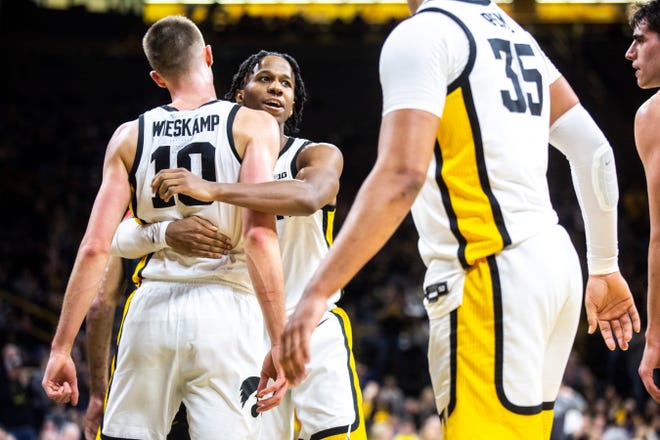 Iowa guard Joe Wieskamp (10) gets embraced by teammate Bakari Evelyn after drawing a foul during a NCAA college Big Ten Conference men's basketball game, Friday, Jan. 10, 2020, at Carver-Hawkeye Arena in Iowa City, Iowa.