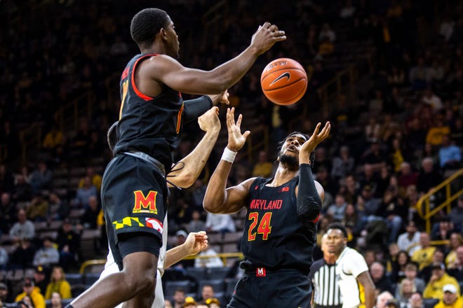 Maryland's Darryl Morsell, left, and Donta Scott (24) attempt to go for a rebound during a NCAA college Big Ten Conference men's basketball game, Friday, Jan. 10, 2020, at Carver-Hawkeye Arena in Iowa City, Iowa.