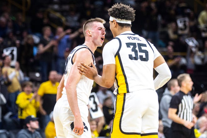 Iowa guard Joe Wieskamp, left, celebrates with teammate Cordell Pemsl after making a 3-point basket during a NCAA college Big Ten Conference men's basketball game, Friday, Jan. 10, 2020, at Carver-Hawkeye Arena in Iowa City, Iowa.