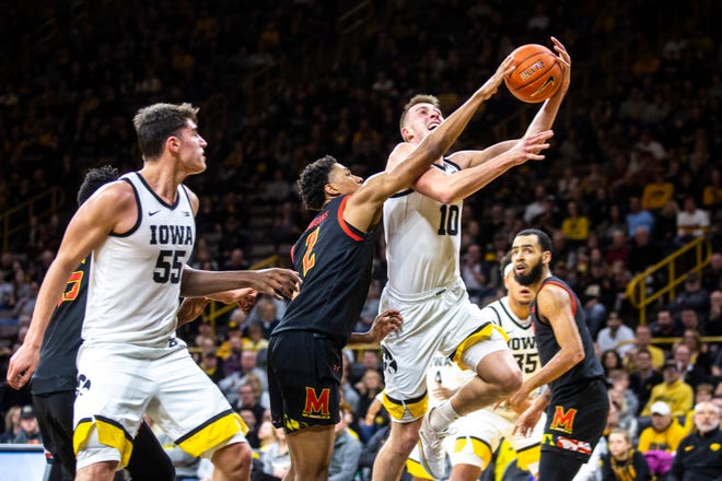 Iowa guard Joe Wieskamp (10) drives to the basket as Maryland's Aaron Wiggins (2) defends during a NCAA college Big Ten Conference men's basketball game, Friday, Jan. 10, 2020, at Carver-Hawkeye Arena in Iowa City, Iowa.