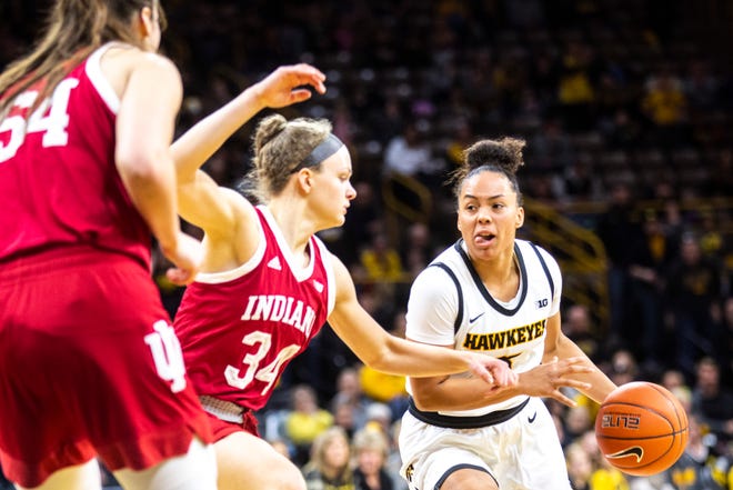 Iowa guard Alexis Sevillian (5) drives to the basket against Indiana's Grace Berger (34) during a NCAA Big Ten Conference women's basketball game, Sunday, Jan. 12, 2020, at Carver-Hawkeye Arena in Iowa City, Iowa.