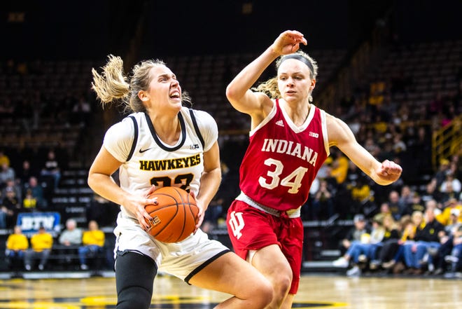 Iowa guard Kathleen Doyle (22) drives to the basket against Indiana guard Grace Berger (34) during a NCAA Big Ten Conference women's basketball game, Sunday, Jan. 12, 2020, at Carver-Hawkeye Arena in Iowa City, Iowa.