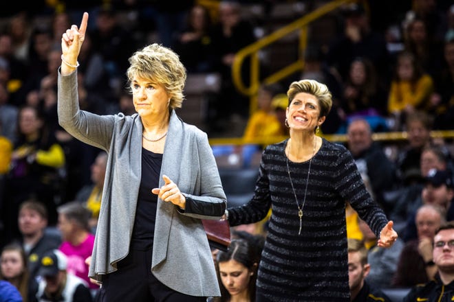 Iowa head coach Lisa Bluder, left, gestures to players as associate head coach Jan Jensen reacts to a call during a NCAA Big Ten Conference women's basketball game against Indiana, Sunday, Jan. 12, 2020, at Carver-Hawkeye Arena in Iowa City, Iowa.