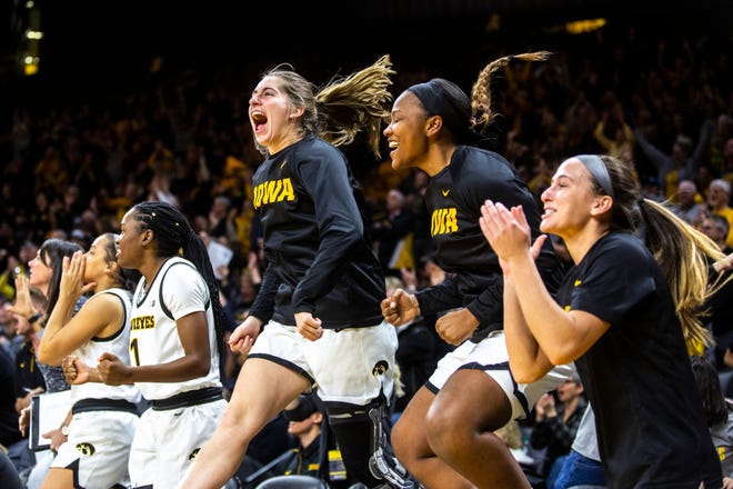 Iowa players celebrate on the bench during a NCAA Big Ten Conference women's basketball game, Sunday, Jan. 12, 2020, at Carver-Hawkeye Arena in Iowa City, Iowa.