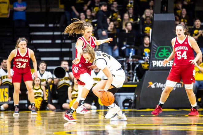 Iowa guard Kathleen Doyle (22) drives to the basket against Indiana's Ali Patberg, left, during a NCAA Big Ten Conference women's basketball game, Sunday, Jan. 12, 2020, at Carver-Hawkeye Arena in Iowa City, Iowa.