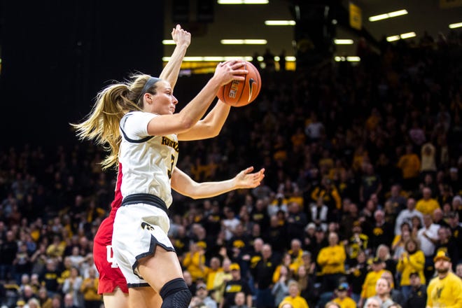 Iowa guard Makenzie Meyer (3) grabs a rebound against Indiana during a NCAA Big Ten Conference women's basketball game, Sunday, Jan. 12, 2020, at Carver-Hawkeye Arena in Iowa City, Iowa.