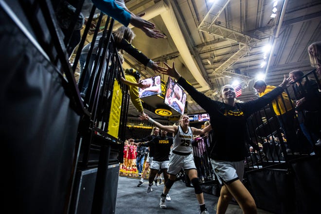 Iowa center Monika Czinano (25) high-fives fans after the Hawkeyes defeating Indiana during a NCAA Big Ten Conference women's basketball game, Sunday, Jan. 12, 2020, at Carver-Hawkeye Arena in Iowa City, Iowa.