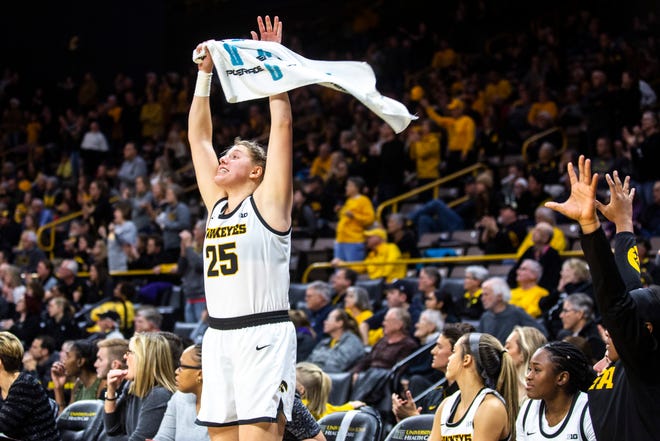 Iowa center Monika Czinano (25) pumps up the crowd during a NCAA Big Ten Conference women's basketball game, Sunday, Jan. 12, 2020, at Carver-Hawkeye Arena in Iowa City, Iowa.