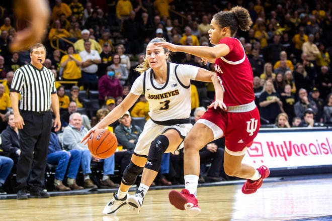 Iowa guard Makenzie Meyer (3) drives to the basket against Indiana guard Jaelynn Penn, right, during a NCAA Big Ten Conference women's basketball game, Sunday, Jan. 12, 2020, at Carver-Hawkeye Arena in Iowa City, Iowa.