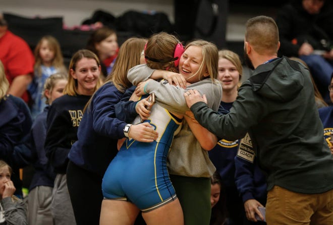 Dubuque Wahlert's Alaina Schmidt celebrates a state title win at 152 pounds over Val Boleyn of North Fayette Valley during the 2020 Iowa girls state wrestling tournament on Saturday, Jan. 25, 2020, at Waverly-Shell Rock High School.