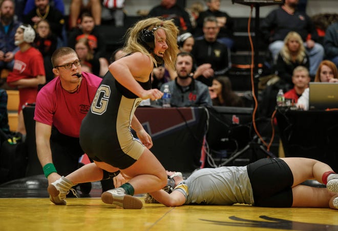 Glenwood senior Abby McIntyre celebrates after pinning Waverly-Shell Rock's Annika Behrends for a state title at 132 pounds during the 2020 Iowa girls state wrestling tournament on Saturday, Jan. 25, 2020, at Waverly-Shell Rock High School.