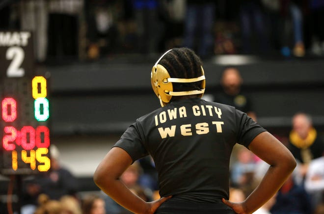 Iowa City West's Mami Selemani prepares for her state title match at 145 pounds against Crestwood's Lakin Lienhard during the 2020 Iowa girls state wrestling tournament on Saturday, Jan. 25, 2020, at Waverly-Shell Rock High School.