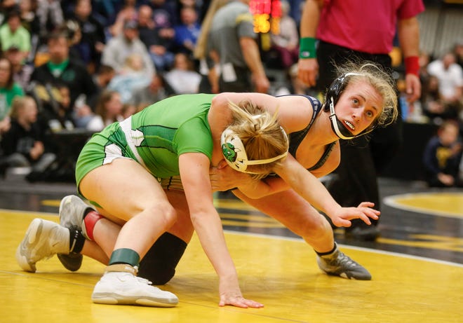 Davenport Central's Sydney Park, right, controls Osage's Emma Grimm in their match at 126 pounds on Saturday, Jan. 25, 2020, at Waverly-Shell Rock High School.