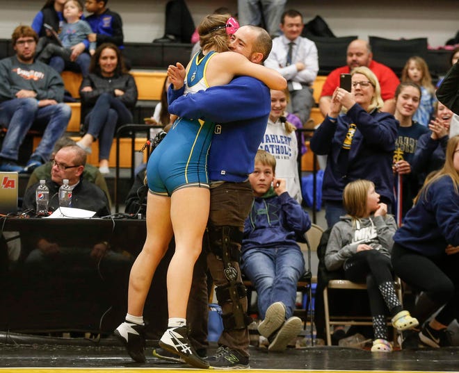 Dubuque Wahlert's Alaina Schmidt celebrates a state title win at 152 pounds over Val Boleyn of North Fayette Valley during the 2020 Iowa girls state wrestling tournament on Saturday, Jan. 25, 2020, at Waverly-Shell Rock High School.