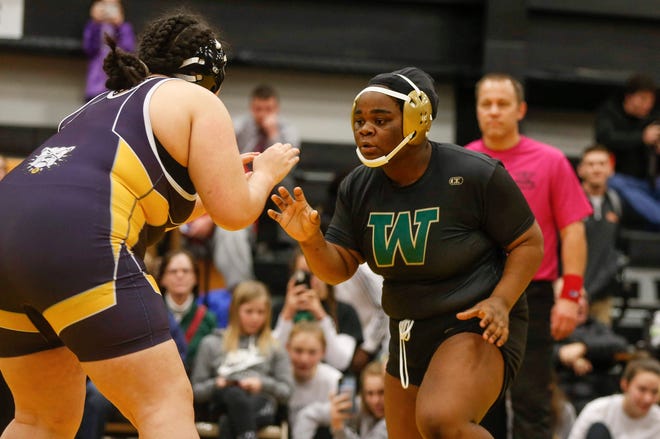 Iowa City West's Salima Omari won a state wrestling title at 285 pounds after pinning Riverside's Iliana Yanes during the 2020 Iowa girls state wrestling tournament on Saturday, Jan. 25, 2020, at Waverly-Shell Rock High School.
