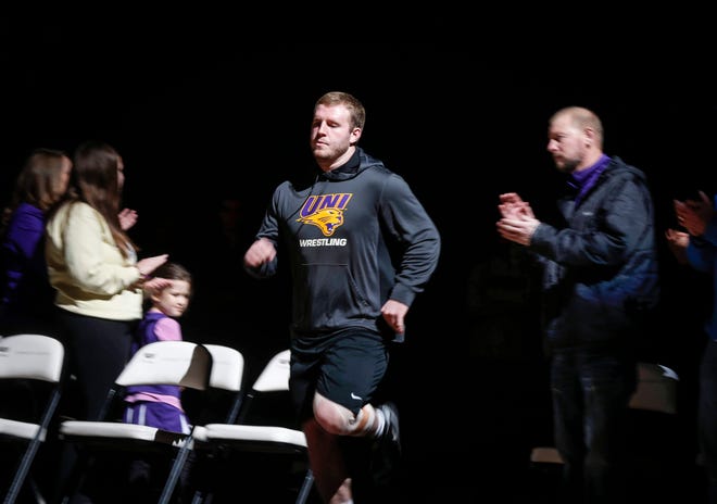 Northern Iowa wrestler Carter Isley makes his way to the center of the mat during pre-meet introductions against Oklahoma State on Saturday, Jan. 25, 2020, at the McCleod Center in Cedar Falls.