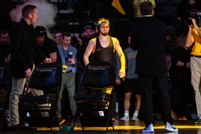 Iowa's Spencer Lee is introduced before his match at 125 pounds during a NCAA Big Ten Conference wrestling dual against Penn State, Friday, Jan. 31, 2020, at Carver-Hawkeye Arena in Iowa City, Iowa.