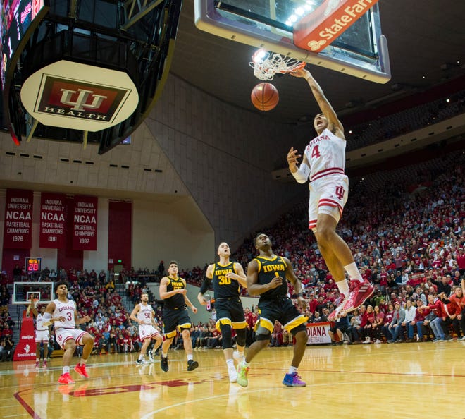 Indiana forward Trayce Jackson-Davis (4) scores with a slam dunk during the first half of an NCAA college basketball game against Iowa, Thursday, Feb. 13, 2020, in Bloomington, Ind. (AP Photo/Doug McSchooler)