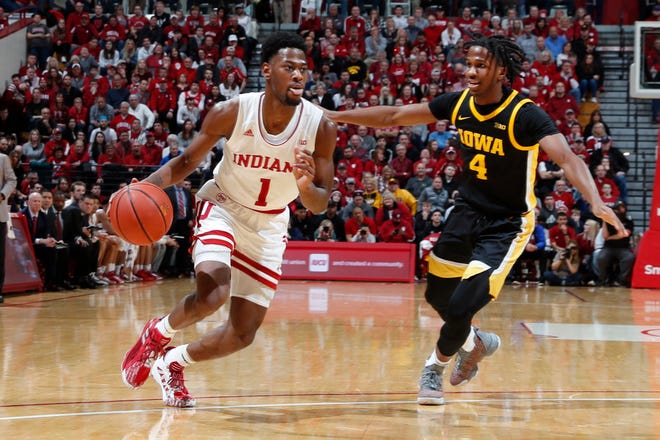 Feb. 13, 2020; Bloomington, Indiana, USA; Indiana Hoosiers guard Aljami Durham (1)  drives to the basket against Iowa Hawkeyes guard Bakari Evelyn (4) during the first half at Simon Skjodt Assembly Hall.