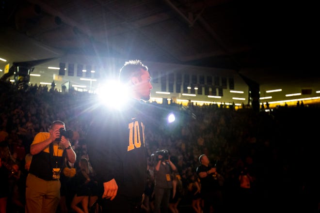 Iowa's Spencer Lee is backlit with a spotlight while wrestlers are introduced during a NCAA Big Ten Conference wrestling dual against Minnesota, Saturday, Feb. 15, 2020, at Carver-Hawkeye Arena in Iowa City, Iowa.