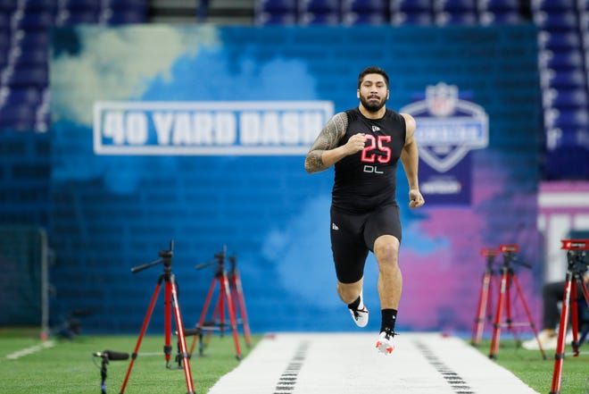 Iowa defensive lineman A.J. Epenesa runs the 40-yard dash at the NFL football scouting combine in Indianapolis, Saturday, Feb. 29, 2020.